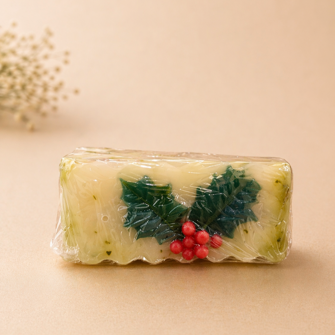 Rectangular soap with holly design on a beige background