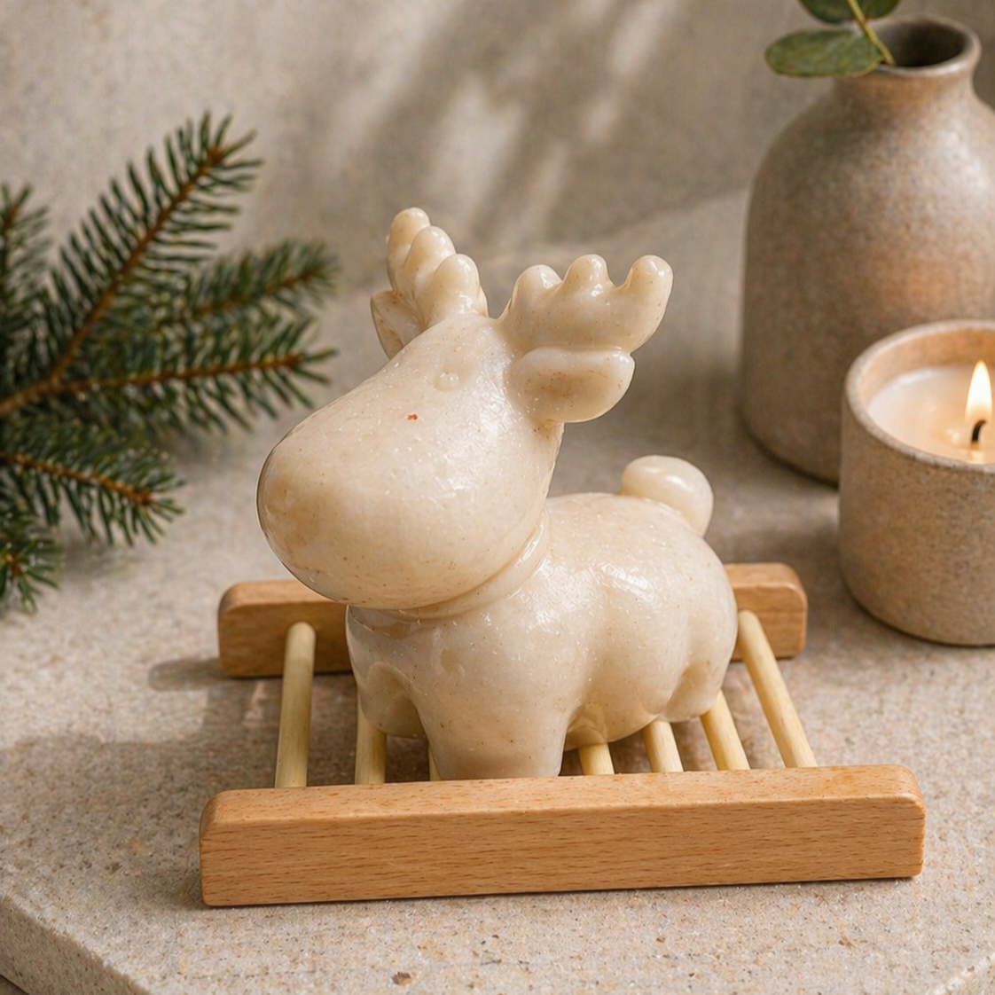 Decorative raindeer soap on a wooden stand with a vase in the background