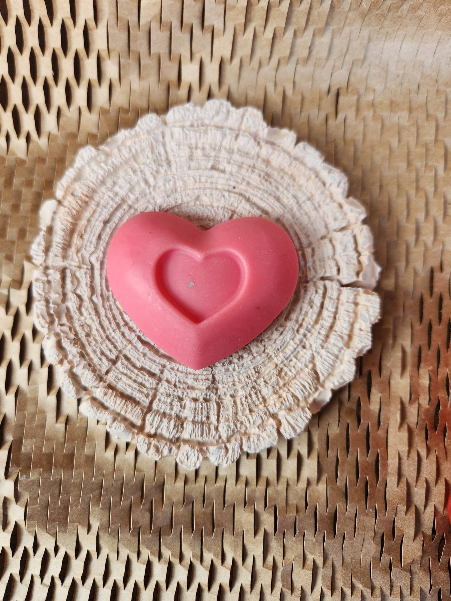 medium heart with another heart in middle