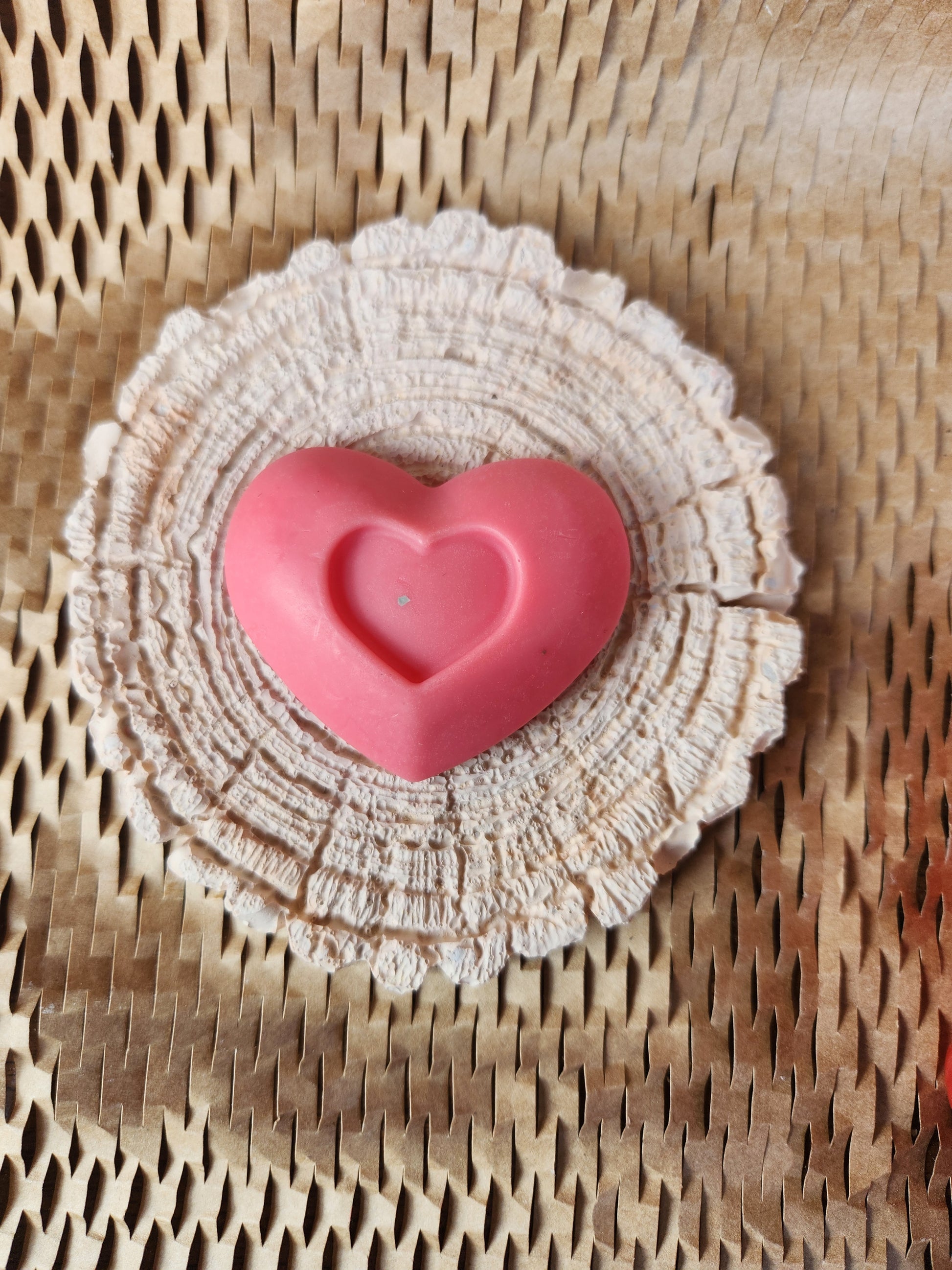 medium heart with another heart in middle
